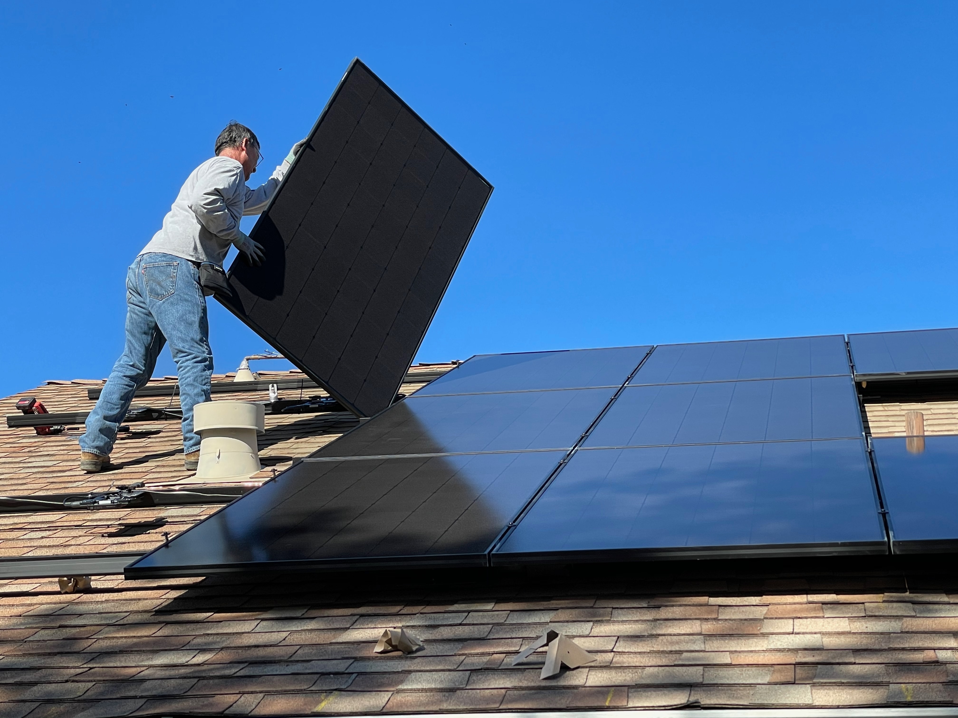 Solar panels being installed on the roof